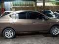 Brown Nissan Almera 2016 at 56000 km for sale -1