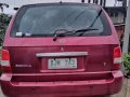 Selling Red Kia Carnival 2003 Manual Diesel in Baguio -2