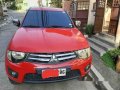 Sell Red 2014 Mitsubishi Strada at 92000 km-0