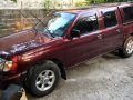 Red Nissan Frontier 2013 at 62000 km for sale -0