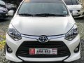 Selling White Toyota Wigo 2019 Hatchback at 5000 km -1