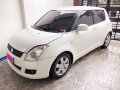 White Suzuki Swift 2010 at 61817 km for sale-2