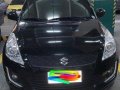 Selling Black Suzuki Swift 2014 Automatic Gasoline  -1