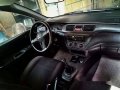 Selling Black Mitsubishi Lancer 2010 Manual Gasoline at 115000 km -2