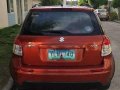 Orange Suzuki Sx4 2014 at 65000 km for sale in Manila-13