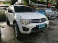 Selling White Mitsubishi Strada 2013 Manual Diesel at 55000 km-1