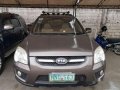 Brown Kia Sportage 2009 for sale in Cainta -6