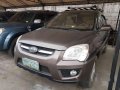 Brown Kia Sportage 2009 for sale in Cainta -2