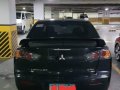 Selling Black Mitsubishi Lancer 2012 in Caloocan-1