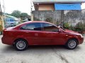 Red Chevrolet Optra 2004 for sale in Manual-5