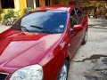 Red Chevrolet Optra 2004 for sale in Manual-8