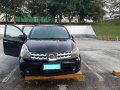 Selling Black Nissan Grand Livina 2011 Automatic Gasoline -0