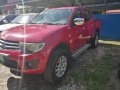 Red Mitsubishi Strada 2011 at 67000 km for sale -3