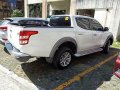 White Mitsubishi Strada 2017 for sale in Silang-17