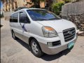 Selling White Hyundai Starex 2006 Van in Alicia-1