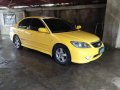 Yellow Honda Civic 2004 for sale in Sta. Rosa-Nuvali Rd.-9