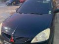 Black Mitsubishi Lancer for sale in Rosario-2