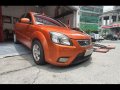 Selling Orange Kia Rio 2010 Sedan in Manila-8