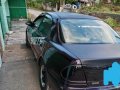 Black Mazda Protege for sale in Dau-2