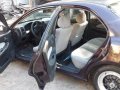 Black Mazda Protege for sale in Dau-0