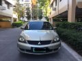 Selling Beige Mitsubishi Lancer for sale in Manila-1