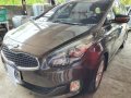 Brown Kia Carens for sale in Butuan-0