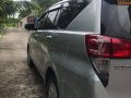 SILVER METALLIC TOYOTA INNOVA 2.8 E M/T 2018 with Franchise and Airport Sticker -2