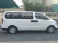 Selling White Hyundai Grand Starex 2017 in Lopez Village Covered Court-5