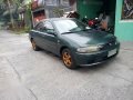 Green Mazda 323 for sale in Bulacan-2