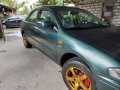 Green Mazda 323 for sale in Bulacan-1