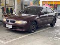 Red Mitsubishi Lancer 2000 Sedan at 113000 km for sale in Manila-5