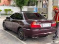 Red Mitsubishi Lancer 2000 Sedan at 113000 km for sale in Manila-2