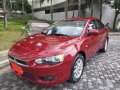 Red Mitsubishi Lancer 2013 for sale in Quezon City-6