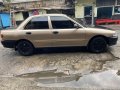 Golden Mitsubishi Lancer 1996 for sale in Caloocan-0