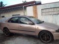 Selling Brown Mazda 323 1997 in San Pedro-3