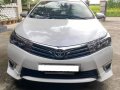 Selling Pearl White Toyota Corolla Altis 2016 in Angat-5