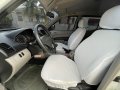  White Mitsubishi Strada 2013 -1