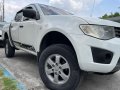  White Mitsubishi Strada 2013 -2