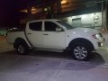  White Mitsubishi Strada 2012-0