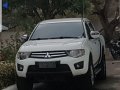  White Mitsubishi Strada 2012-5