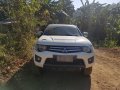  White Mitsubishi Strada 2012-4