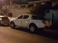  White Mitsubishi Strada 2012-2