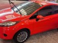 Orange Ford Fiesta 2012-3