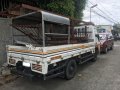 Selling White and Yellow Isuzu Elf 2015 in Imus-0