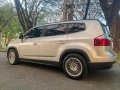 Selling Pearl White Chevrolet Orlando 2014 in Quezon-6