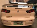 Selling Pearl White Mitsubishi Lancer 2010 in Muntinlupa-1
