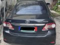 Selling Black Toyota Corolla Altis 2011 in Kalayaan-1