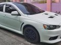 Pearl White Mitsubishi Lancer 2010 for sale in Quezon City-8