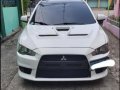 Pearl White Mitsubishi Lancer 2010 for sale in Quezon City-2