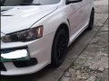 Pearl White Mitsubishi Lancer 2010 for sale in Quezon City-1